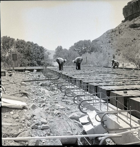 Laying steel over pans for concrete floor of first floor of the Mission 66 Visitor Center and Museum during construction.