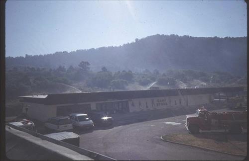 Firefighters provide structural protection to commercial buildings during the Bircher fire, Mesa Verde National Park, July 2000