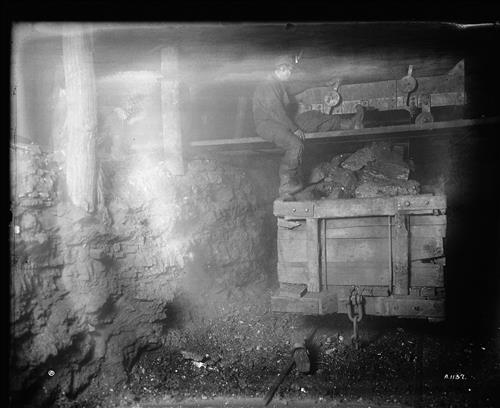 A1137-A1138--Unknown location--Mine scene--Conveyor Type Equipment for Loading Mined Coal into Mine Cars [1915]