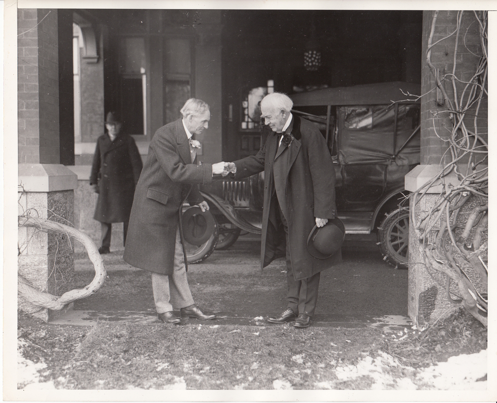 Henry Ford shaking hands with Edison in front of Glenmont on the latter's 80th birthday.