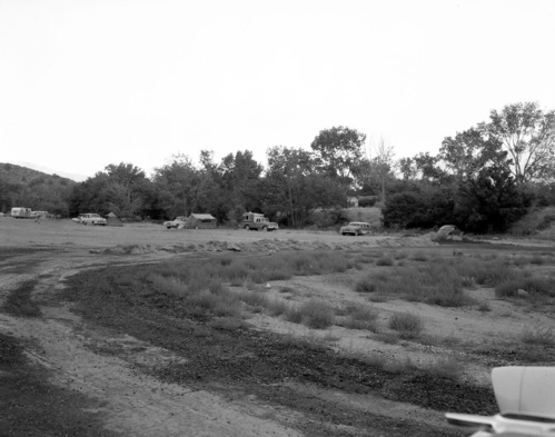 Camper use of overflow area, South Campground overcrowding group area and in gravel mixing area.