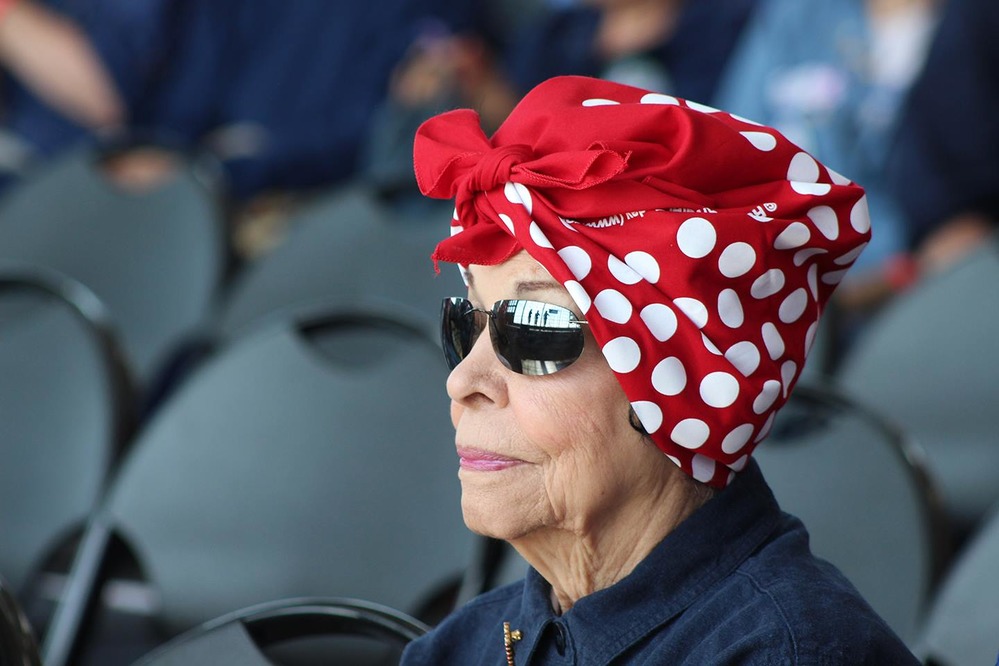 Older woman dressed as Rosie.