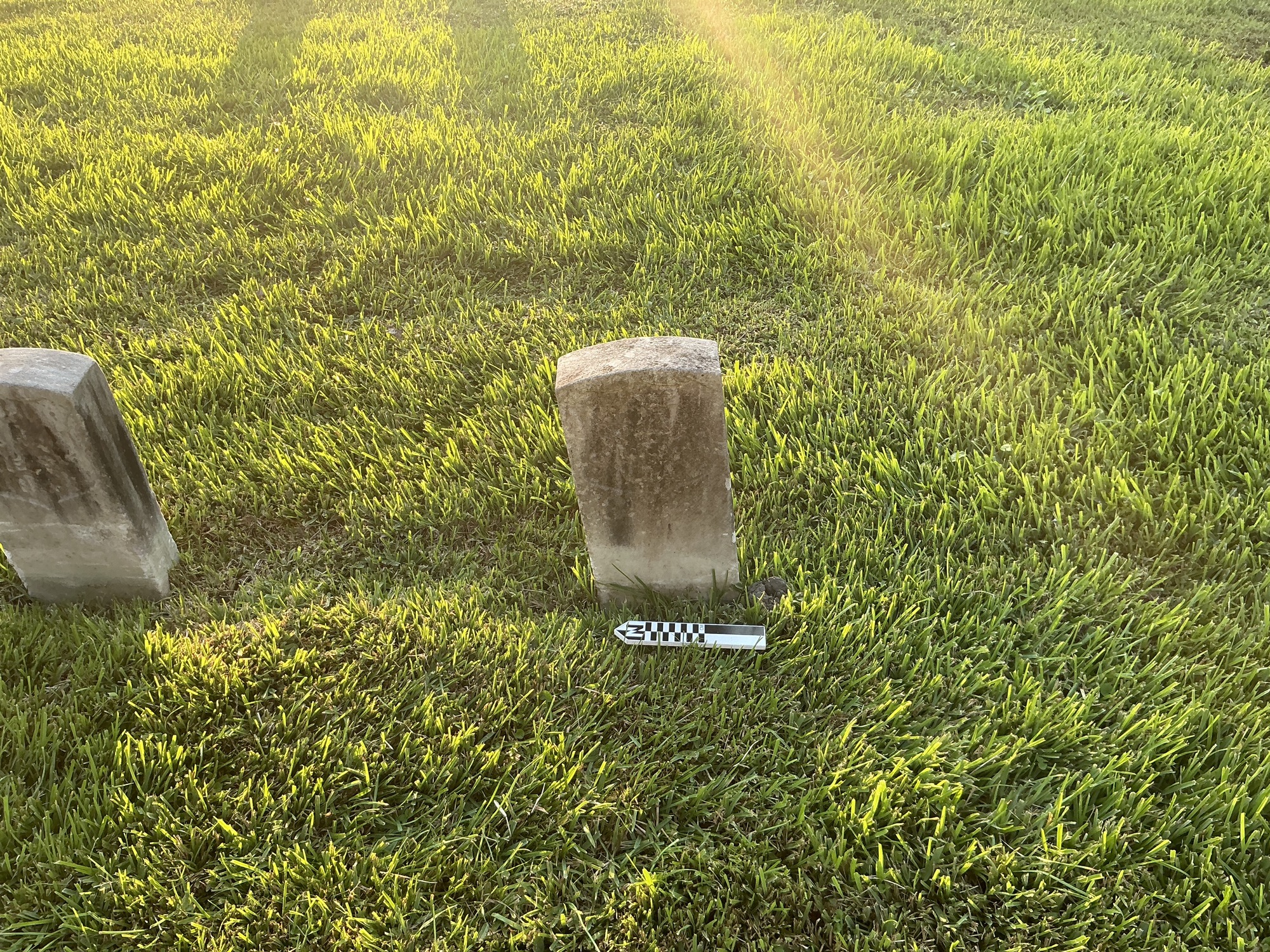 Extra image of historic upright marble headstone with recessed shield face.