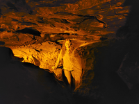 A person stands in the narrow passage. 