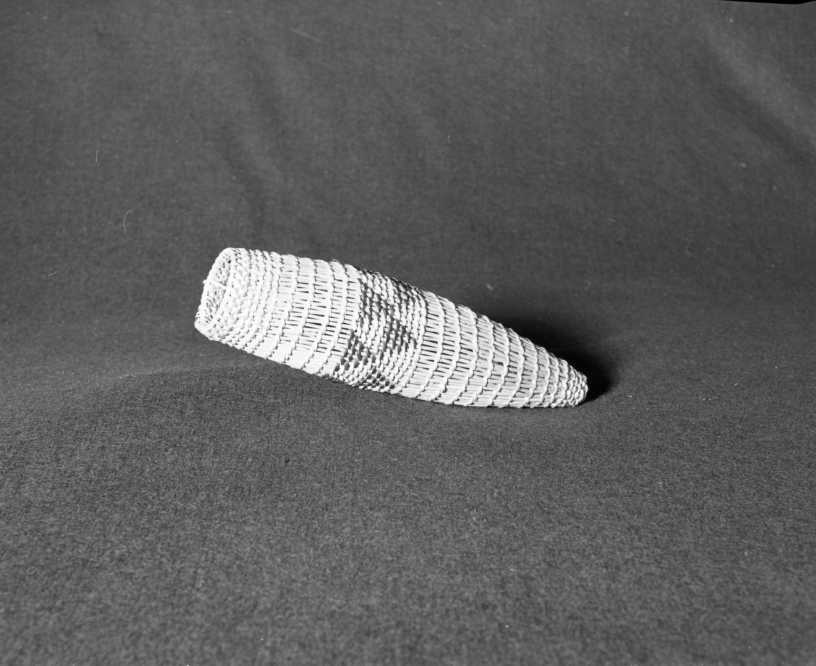 Marie Rozier Collection, Catalog No. 36. Object: Miwok trinket basket. Dimensions: 10 1/2 x 2". Materials: split redbud, split chararral, peeled shoots. Technology: diagonally twined, rim finish with two rows coiling on top. Collection History: Alice Reade Collection. Photographed by Michael Dixon in December 1982. Catalogued by Craig Bates and Barbara Beroza. Yosemite Collections, National Park Service.