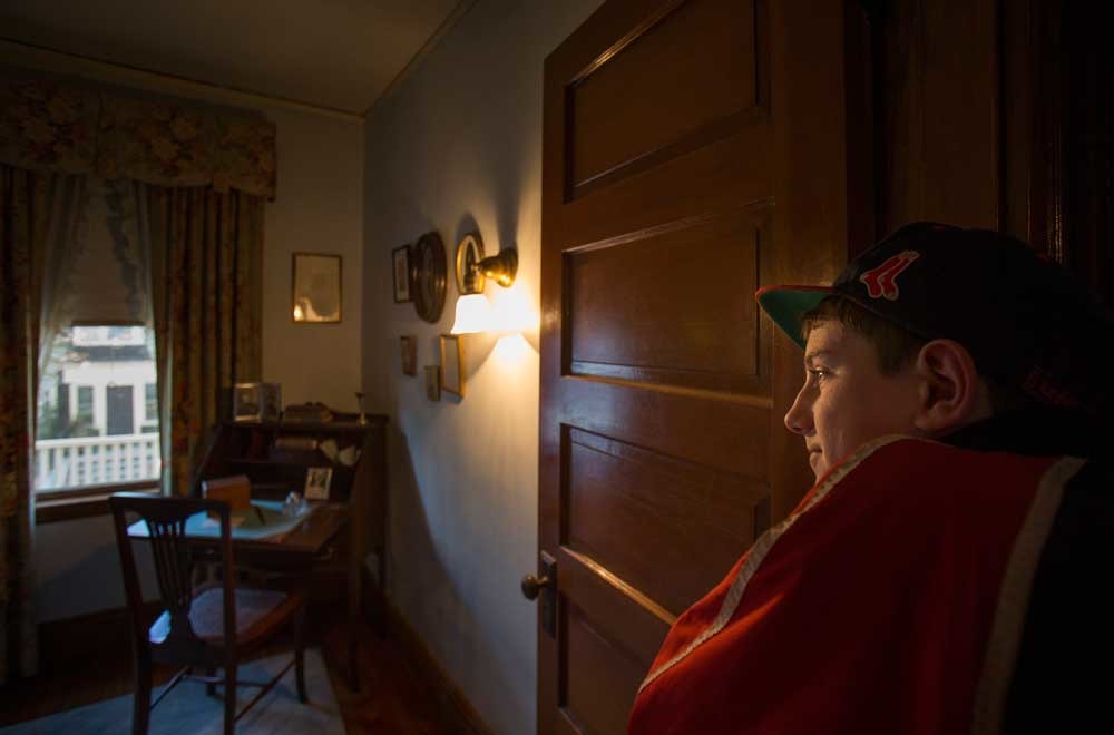 A visitor looks at Mrs. Kennedy's Boudoir