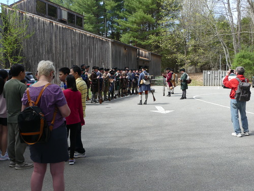 Reenactors lining up behind Visitor Center before Battle Road event
