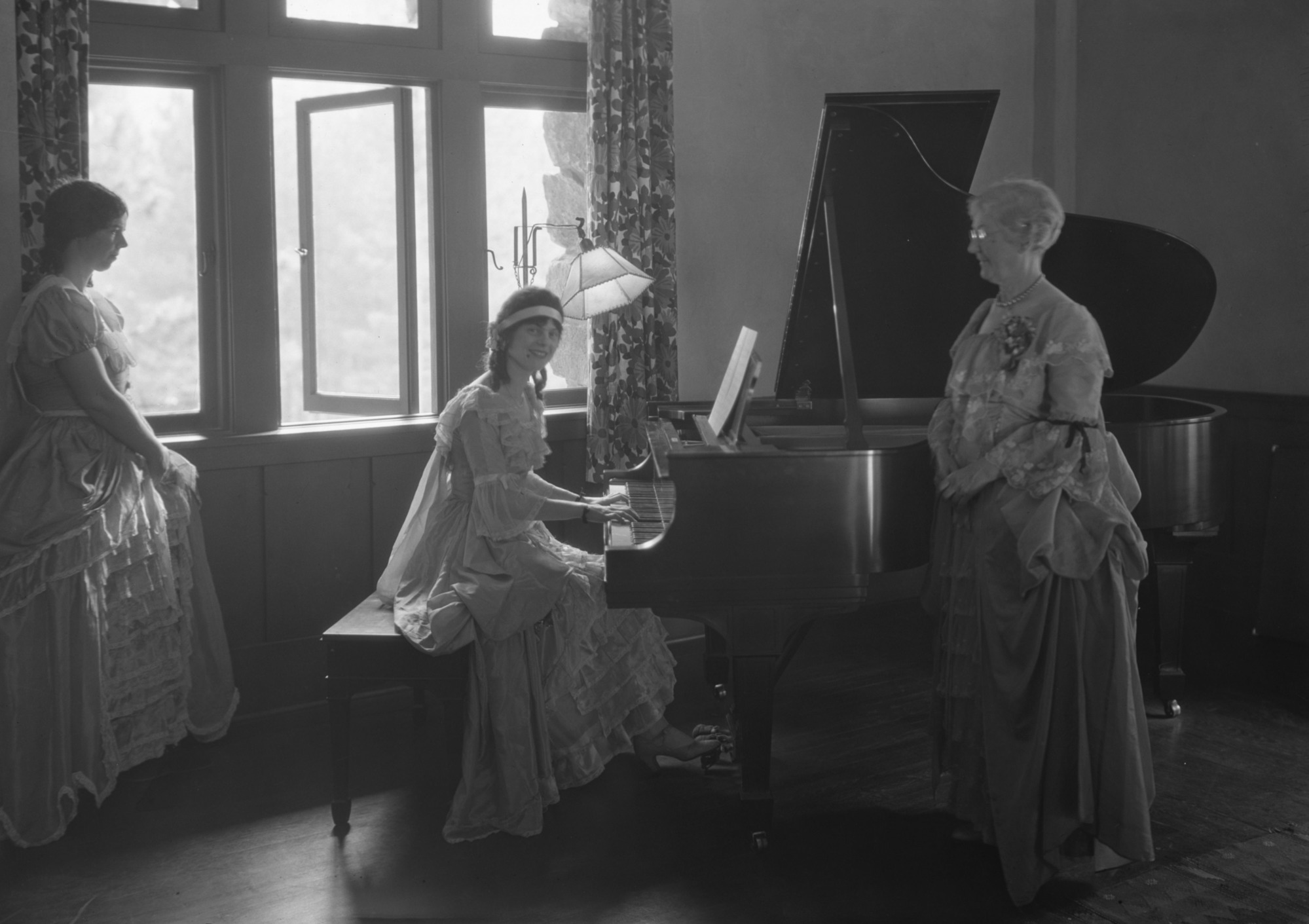 Ahwahnee Christmas. Mary Curry Tresidder on the left and Miss Oliene Tresidder playing the piano. Copy Neg: L. Radanovich, 8/94