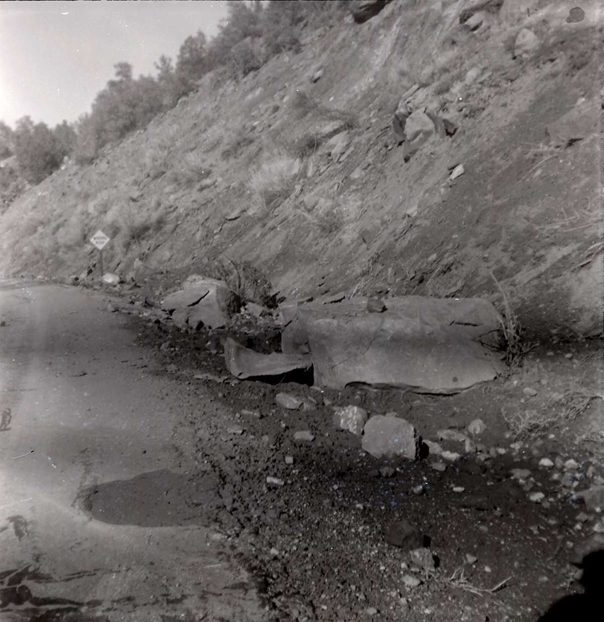 Side of the road with large rocks during construction along the scenic canyon drive near the Grotto.