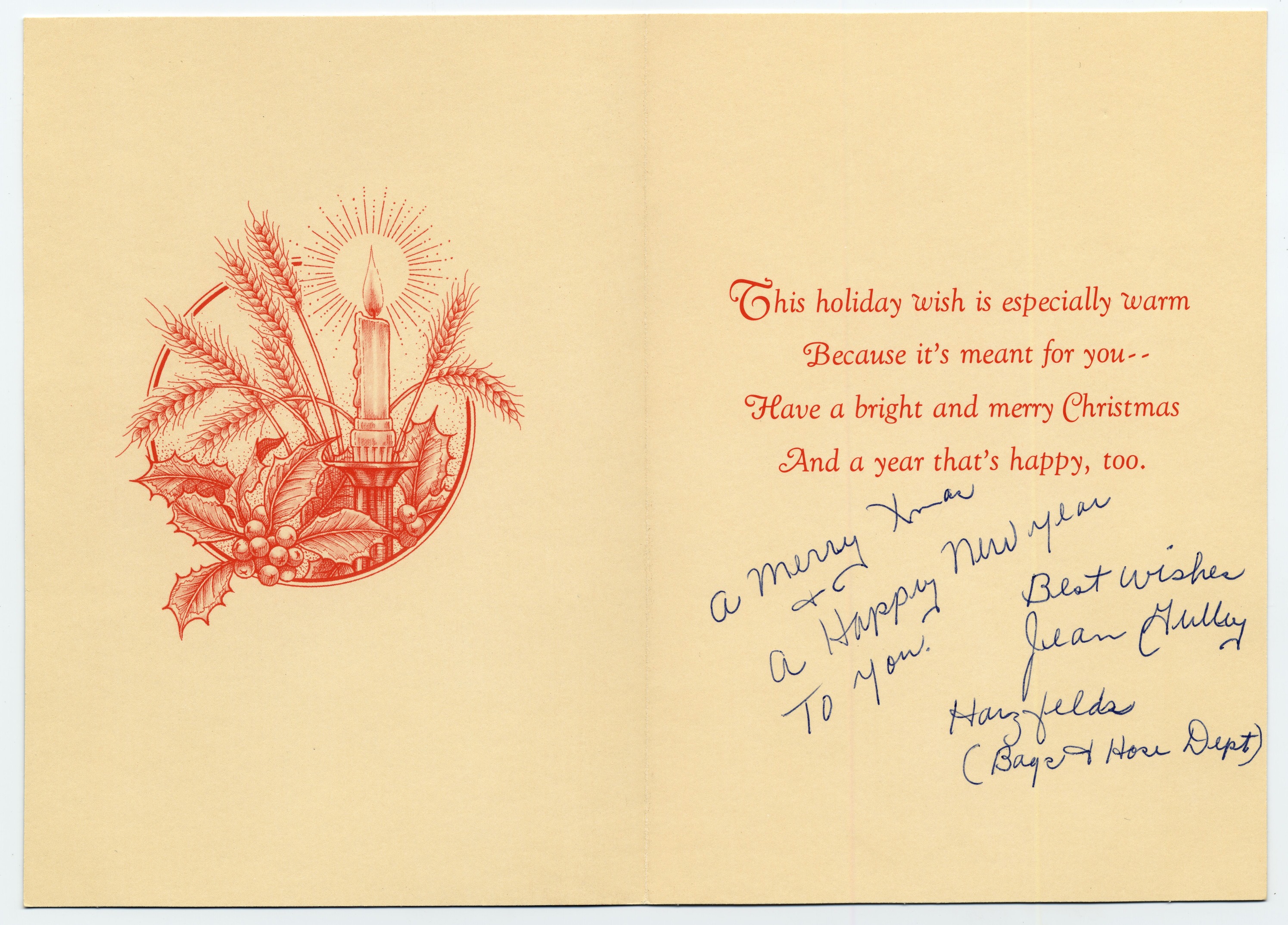 A holiday card with a photo of candles, wheat and holly in a basket on the front.