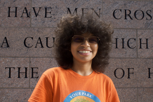 President's Park student volunteer,  Sofia Flores smiling at WW1 Memorial.