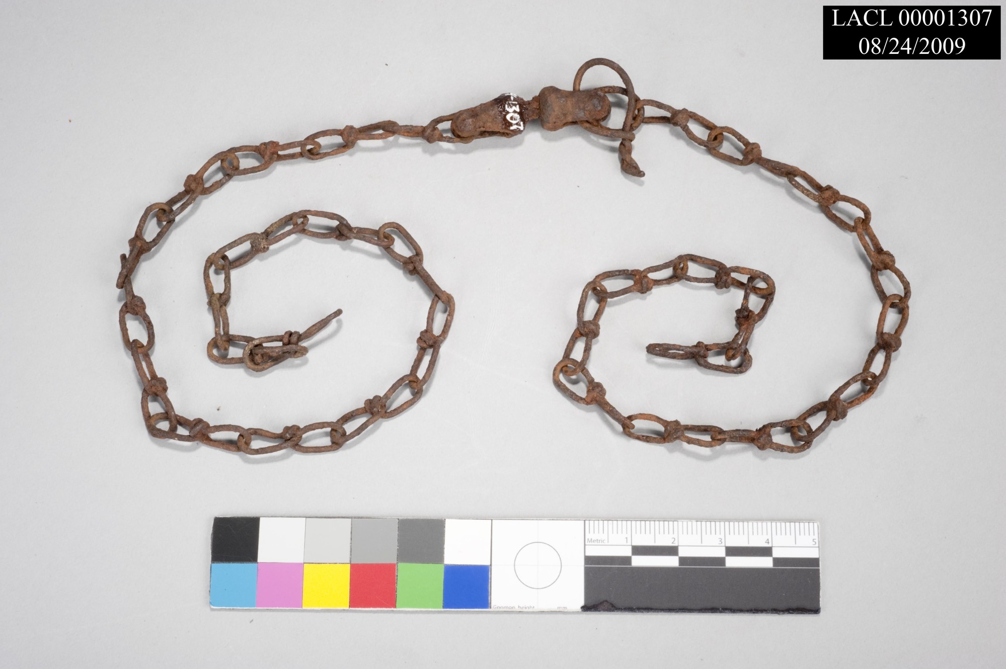 Image of a rusted, wire chain.