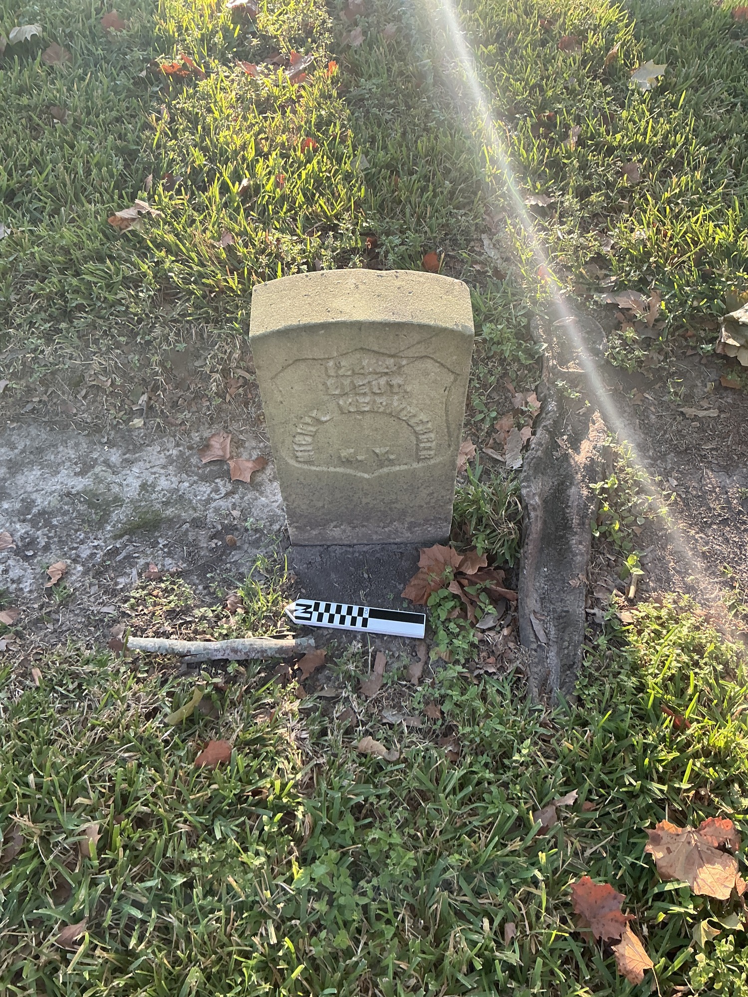 Extra image of historic upright marble headstone with recessed shield face.