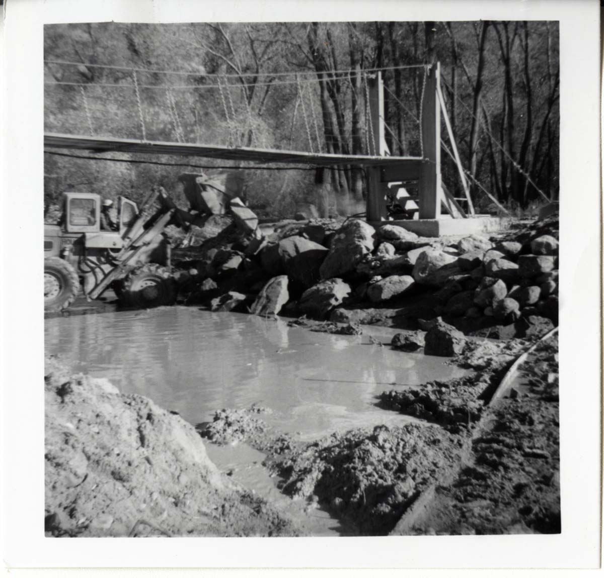 Protection/stabilization of the footings for the old Birch Creek suspension footbridge.