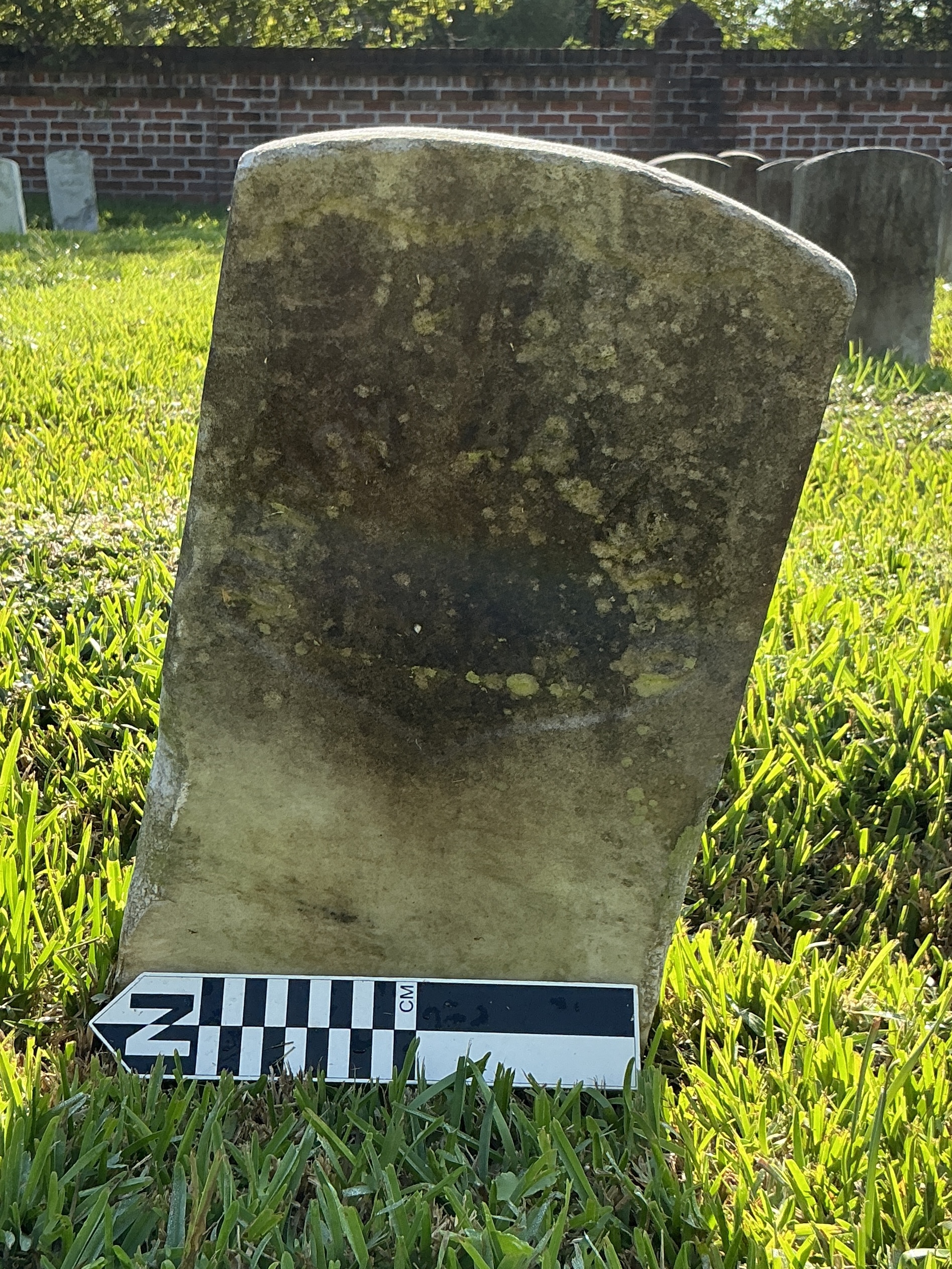 Extra image of historic upright marble headstone with recessed shield face.