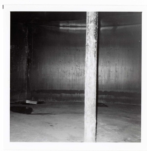 The interior of the 40000 gallon water tank showing buildup/corrosion.