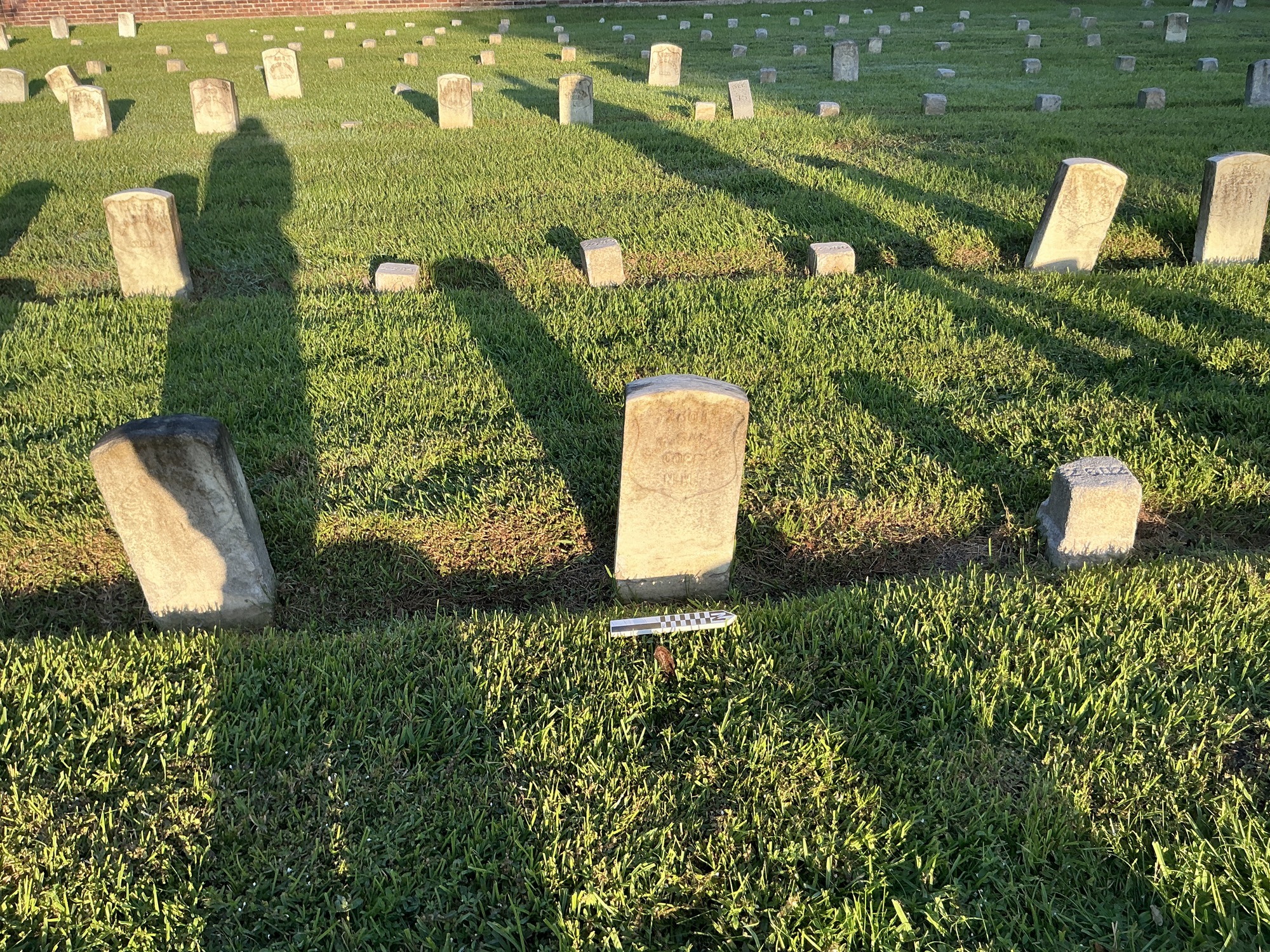 Extra image of historic upright marble headstone with recessed shield face.