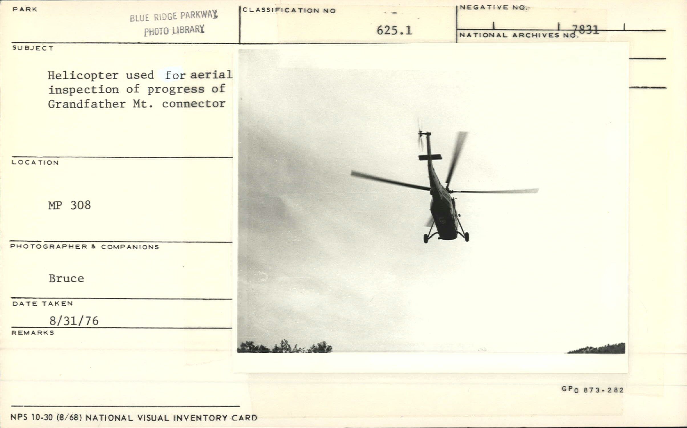 Helicopter flying for aerial inspection of Grandfather Mountain construction