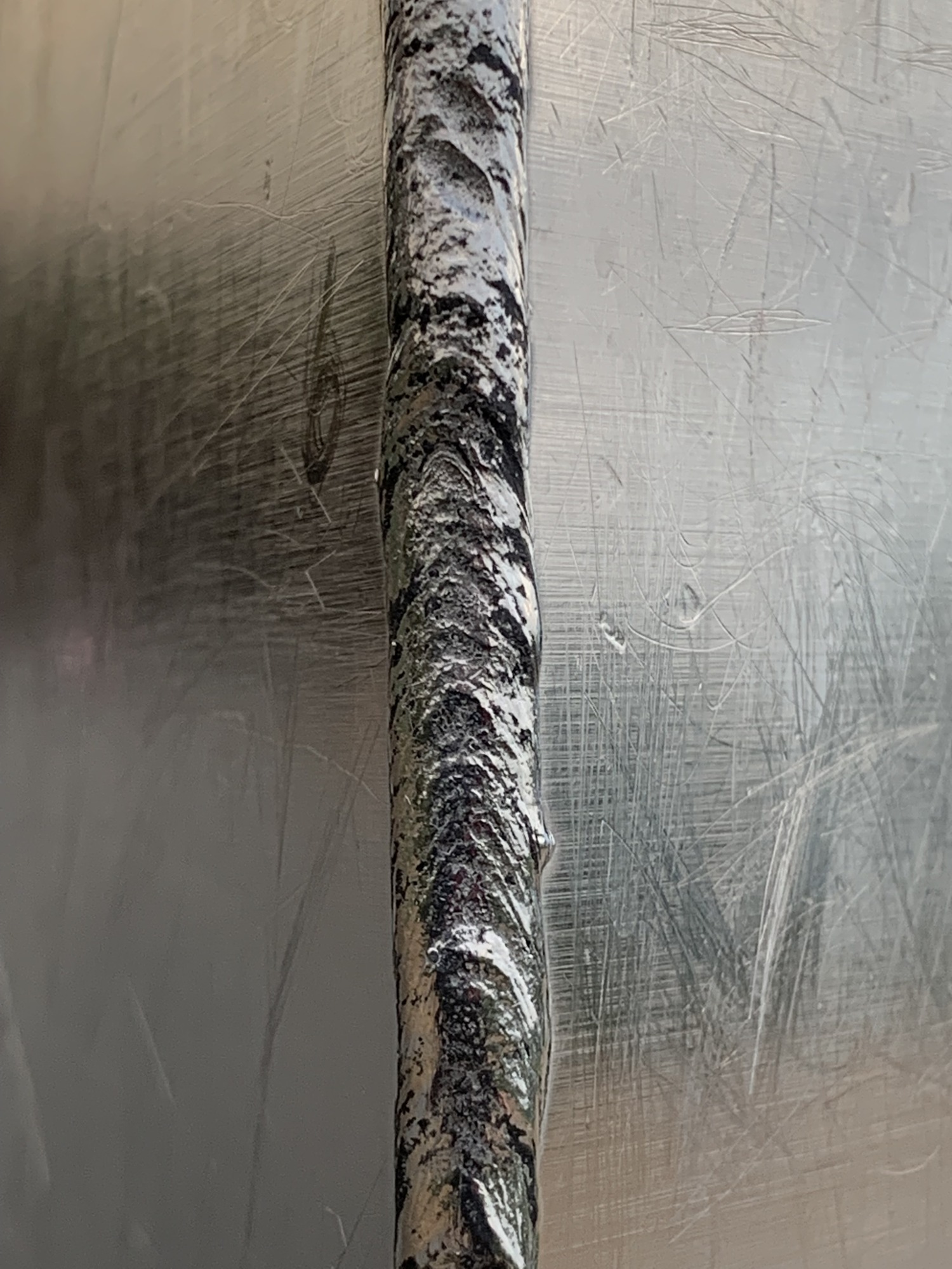 Close-up of a weld along the edge of the gateway Acch.