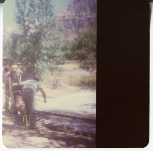 Men working on draining operations along the Zion-Mt. Carmel Highway switchbacks.