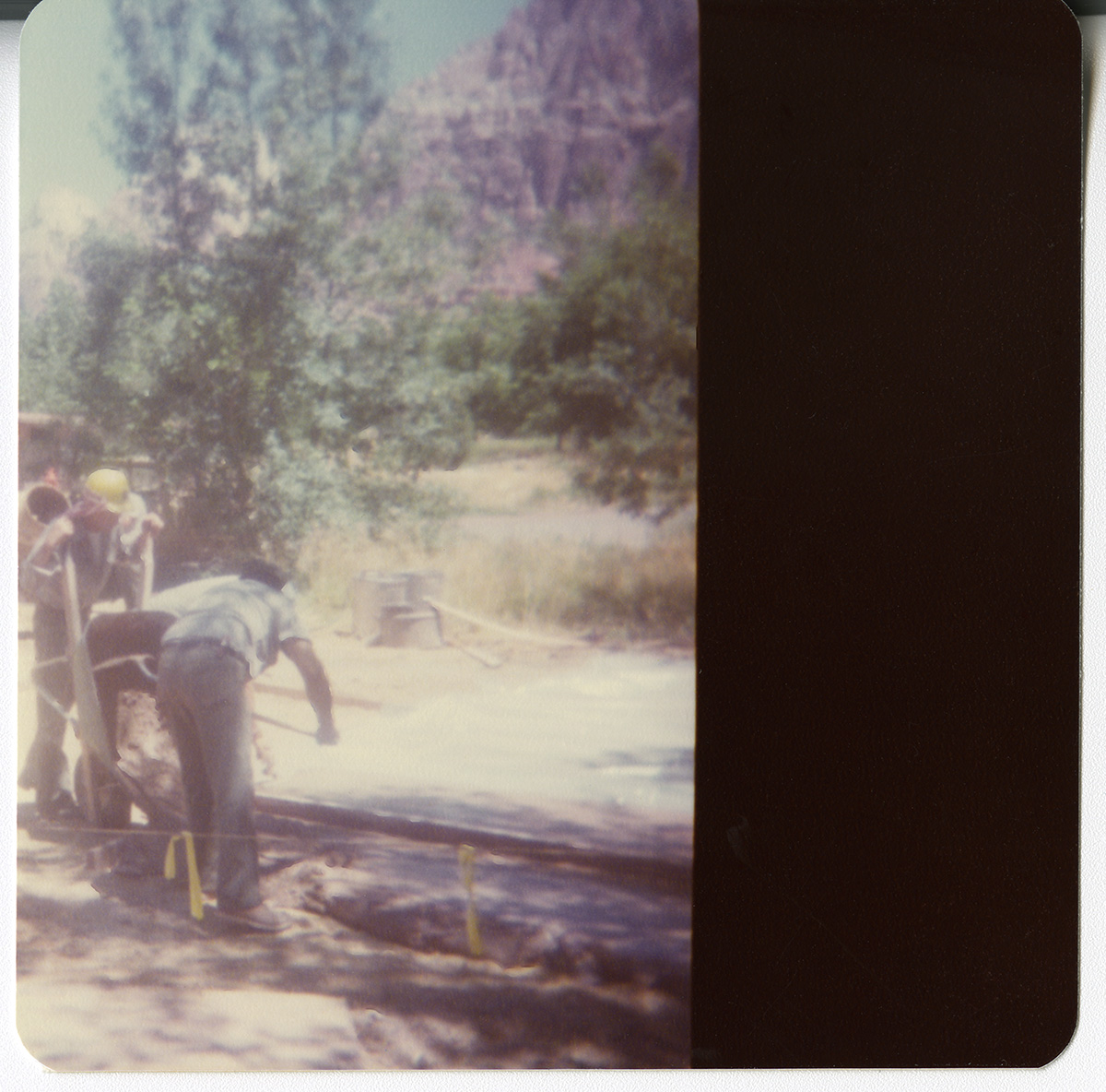 Men working on draining operations along the Zion-Mt. Carmel Highway switchbacks.