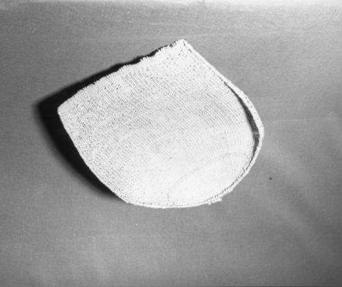 Private Collection. Object: Costanoan basket. Dimensions: 56 x 43 cm. Materials: sedgeroot, equisetum root, unidentified shoots, rimstick unid. (red bark). Technology: starts with one row of plain twining, up to right slant of turns, then row of bound weave, three rows of plain twining with alternate slants of turns, body of basket in diagonal twining, with one row of plain twining 13 cm from start, wrapped and stitched rim finish. Photographed by Michael Dixon. Catalogued by Craig Bates and Barbara Beroza. Yosemite Collections, National Park Service.