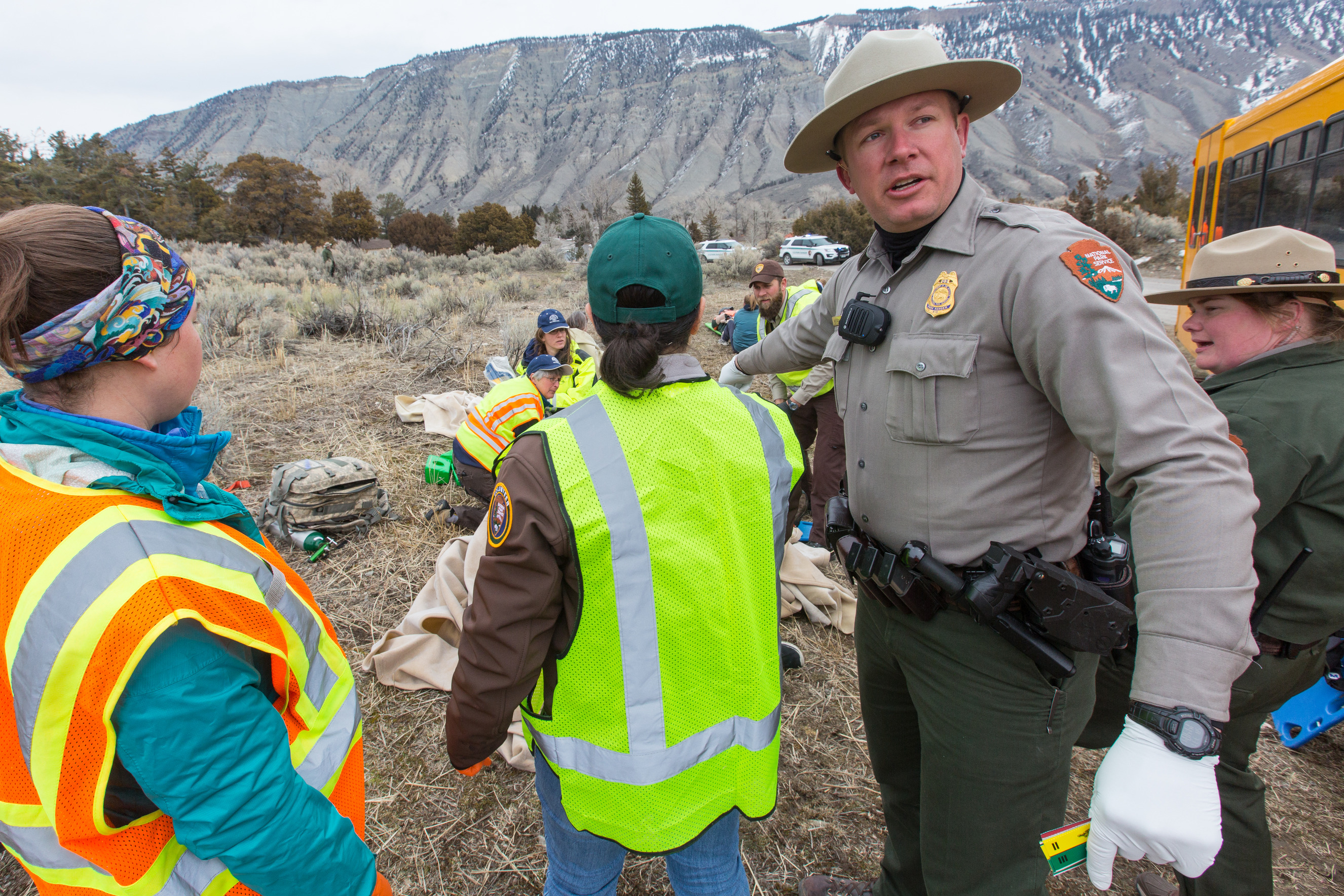 Ranger and many people are outside practicing emergency response to injuries.