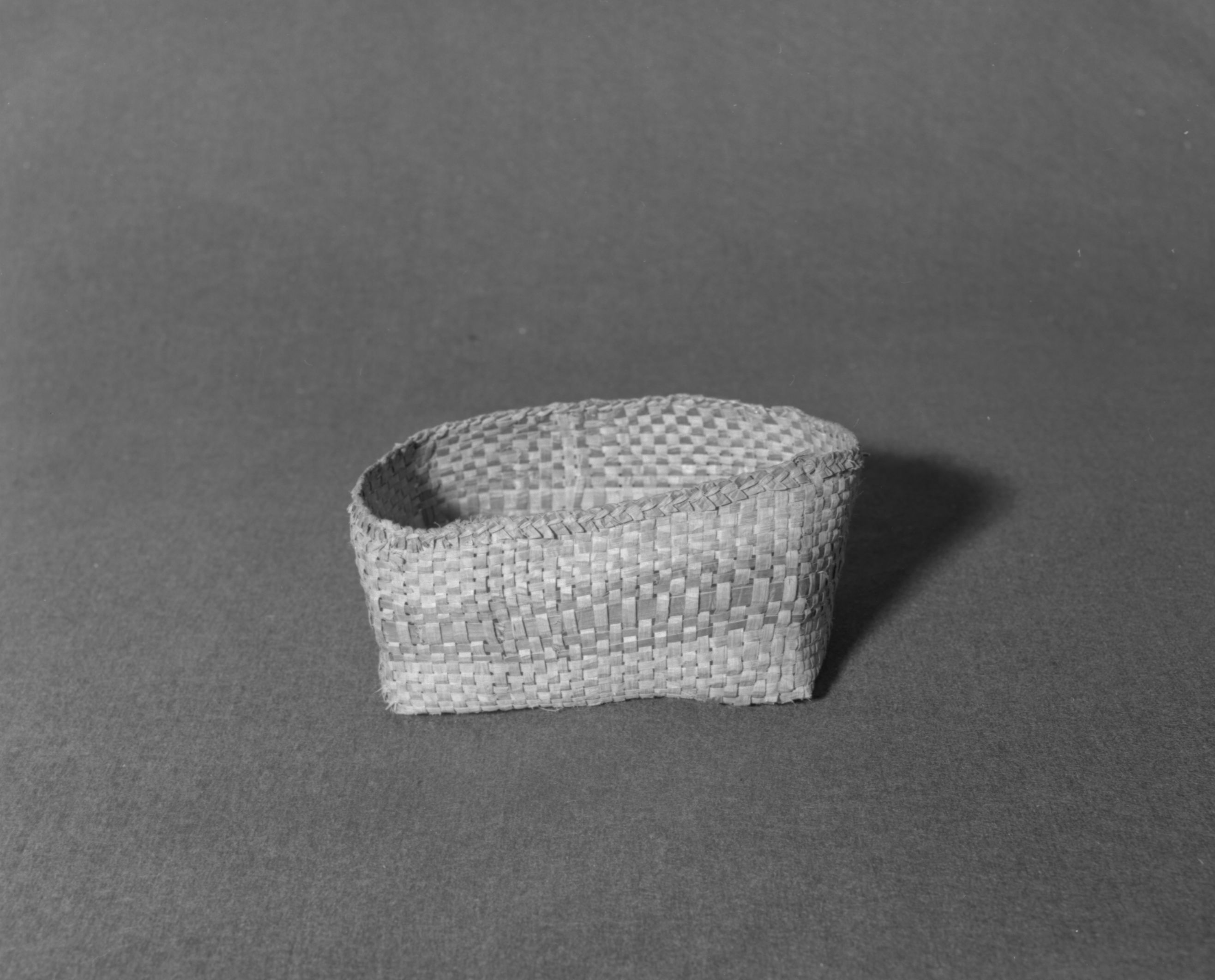 Marie Rozier Collection, Catalog No. 277. Object: Nootka basket. Dimensions: 9 x 6 x 4". Materials: Western red cedar. Technology: Plaited basket. Collection History: Acquired from M. Steinbach. Photographed by Michael Dixon in December 1982. Catalogued by Craig Bates and Barbara Beroza. Yosemite Collections, National Park Service.