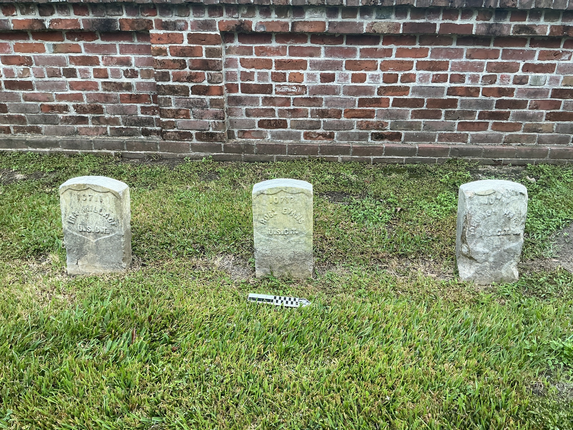 Extra image of historic upright marble headstone with recessed shield face.