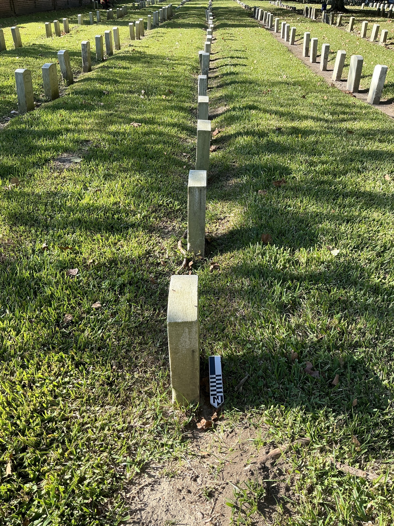 Extra image of historic upright marble headstone with recessed shield face.