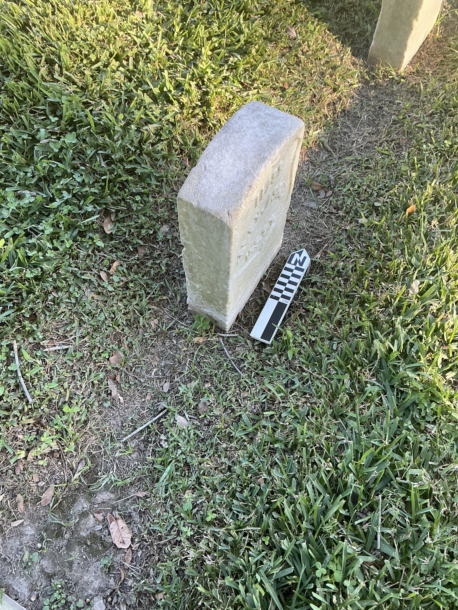 Extra image of historic upright marble headstone with recessed shield face.