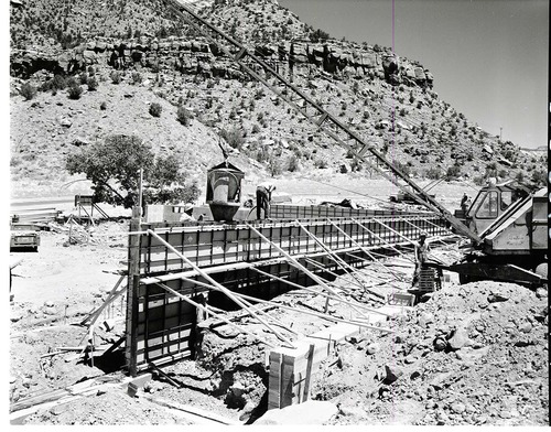 Pouring cement for east wall of basement at Mission 66 Visitor Center and Museum construction.