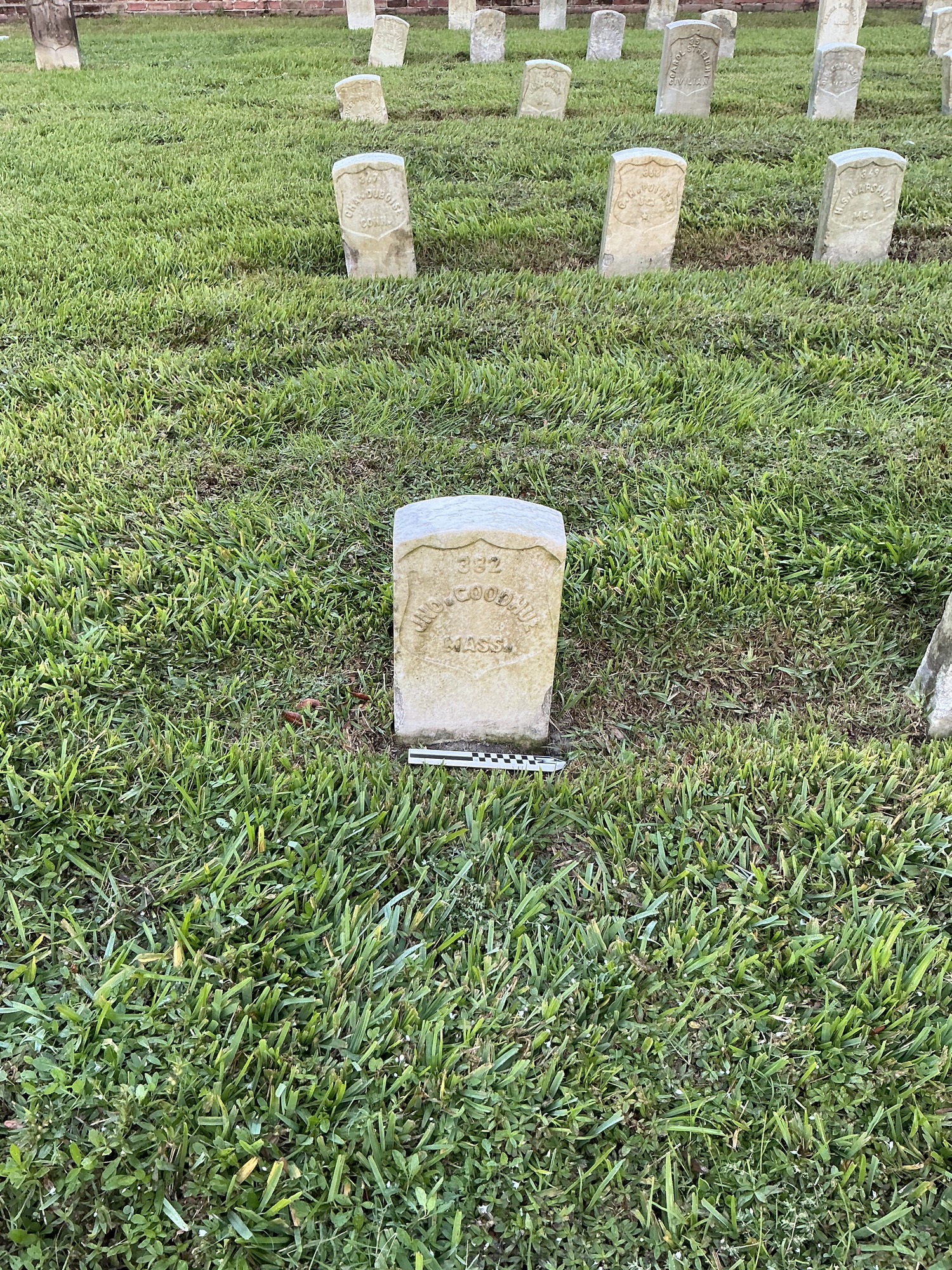 Extra image of historic upright marble headstone with recessed shield face.