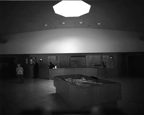 Visitors viewing the interpretive display in the old Mission 66 Visitor Center and Museum.