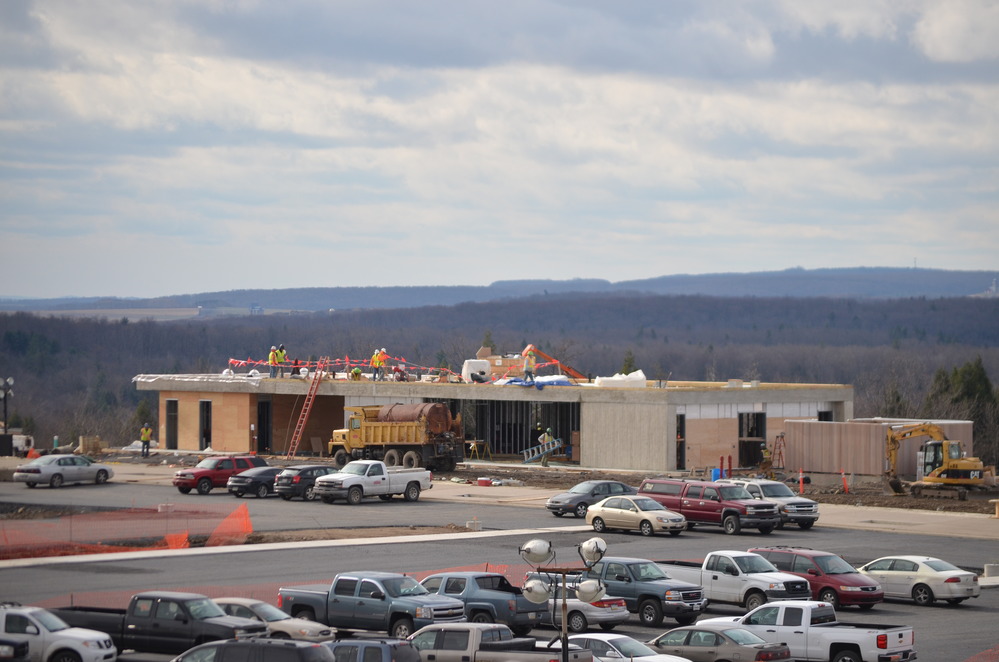 Construction work on the learning center.  Learning Center is concrete rectangular building parital complete