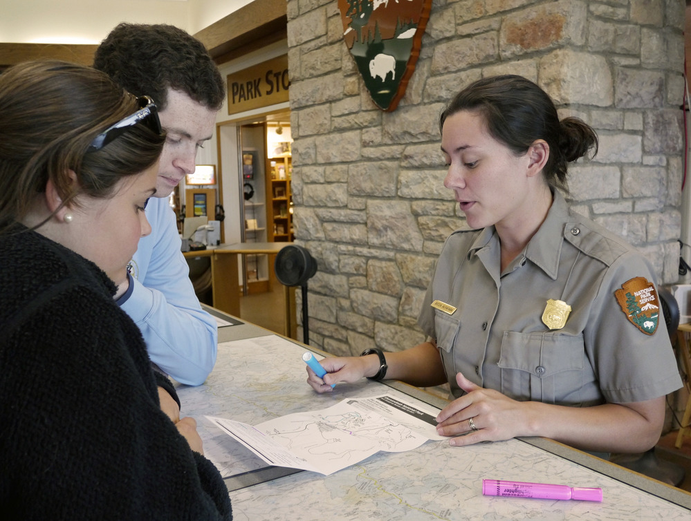 A ranger discusses with visitors options for enjoying their visit to Shenandoah National Park