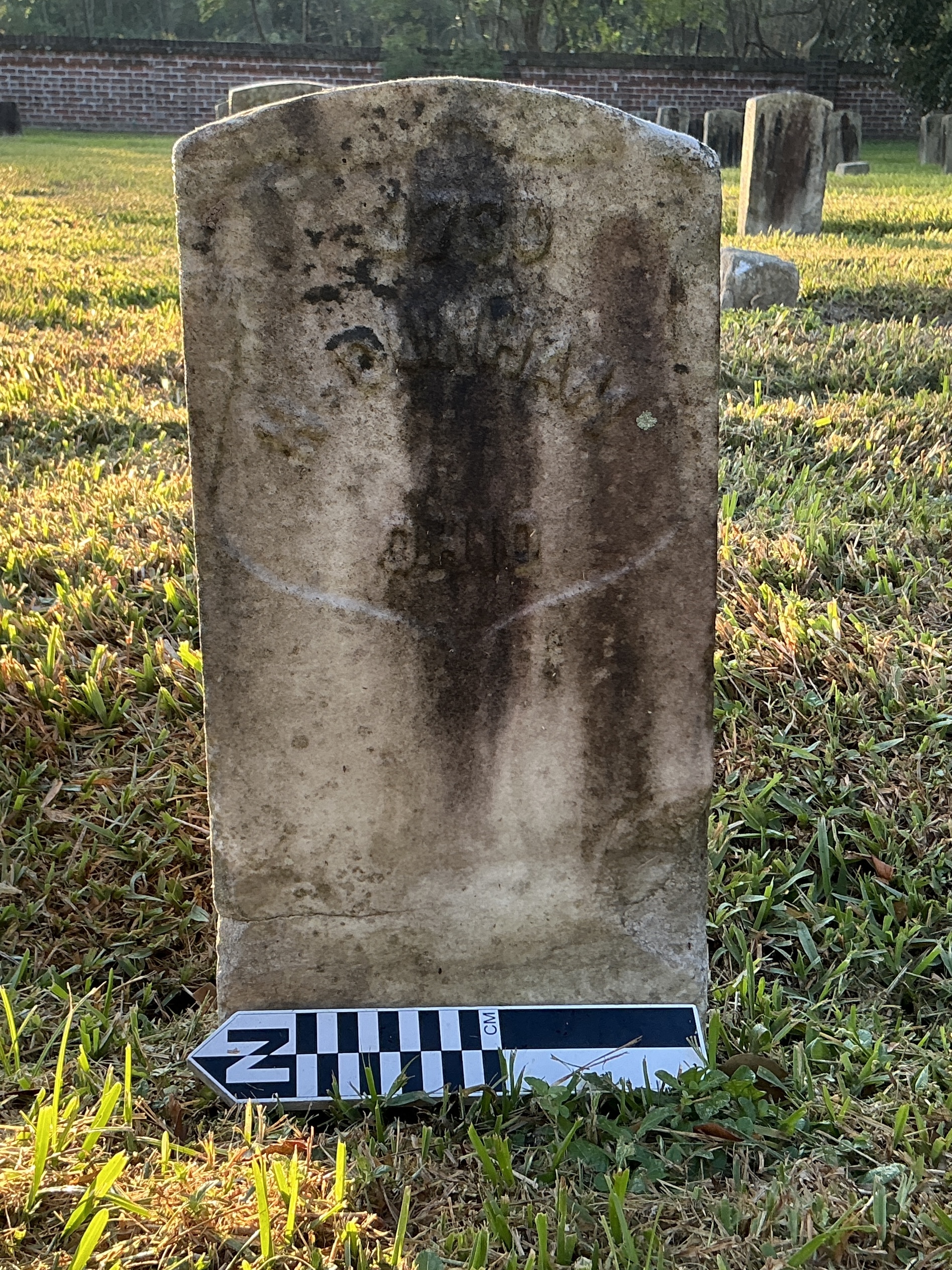 Extra image of historic upright marble headstone with recessed shield face.