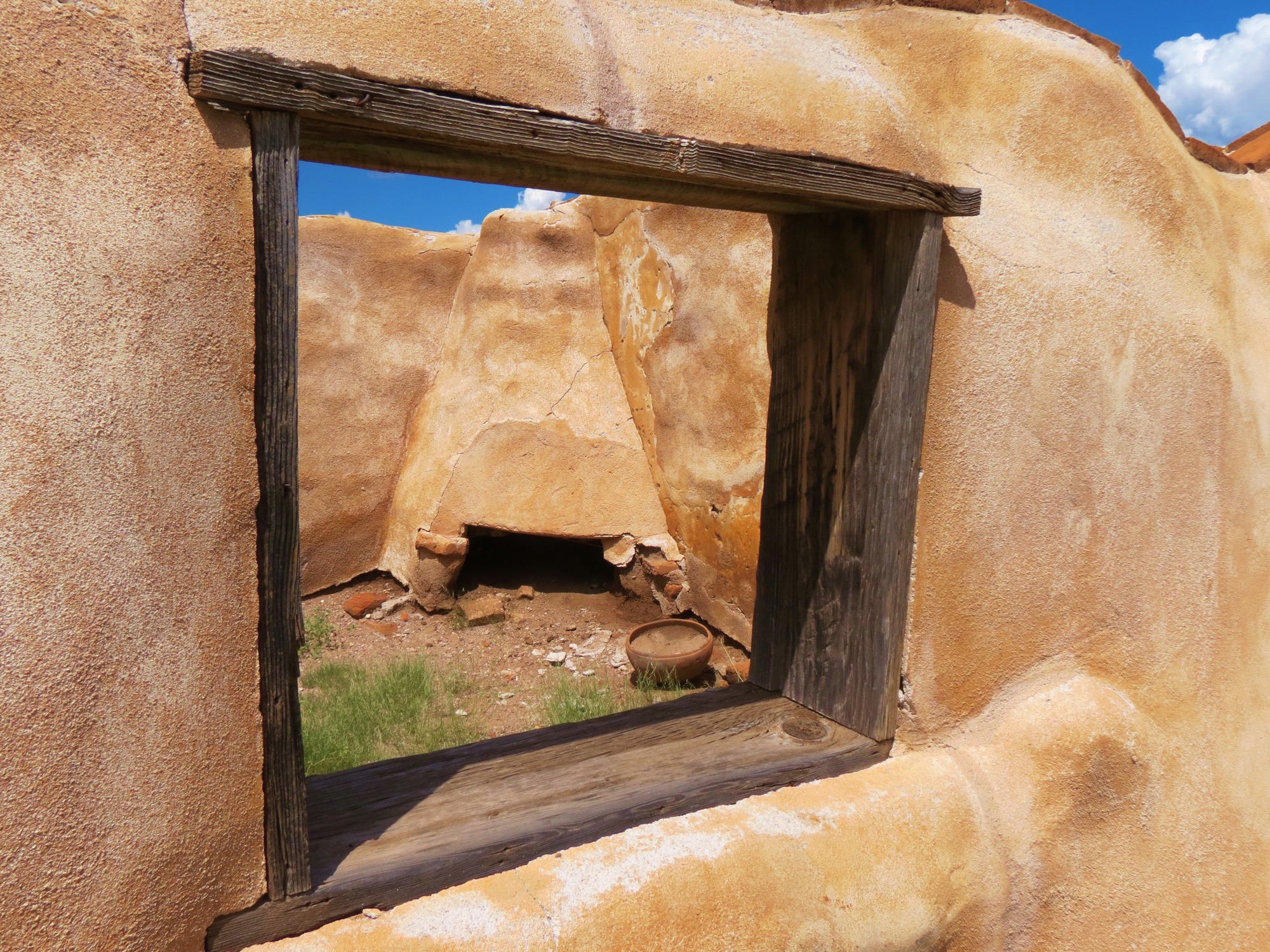Mission convento fragment through window, fireplace visible
