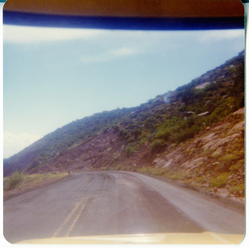 View along the Kolob Terrace Road - North Unit through the windshield of a vehicle.