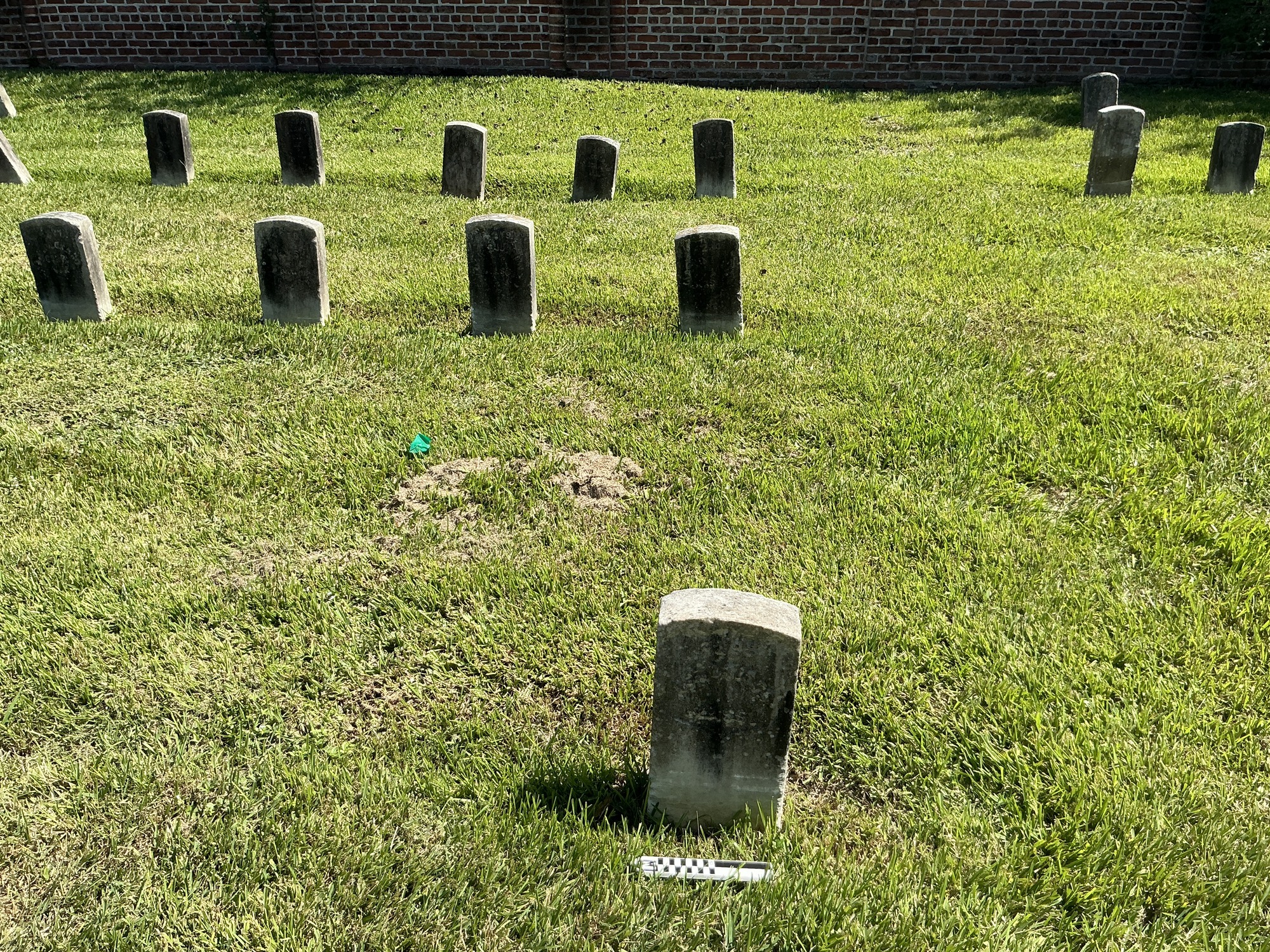 Extra image of historic upright marble headstone with recessed shield face.