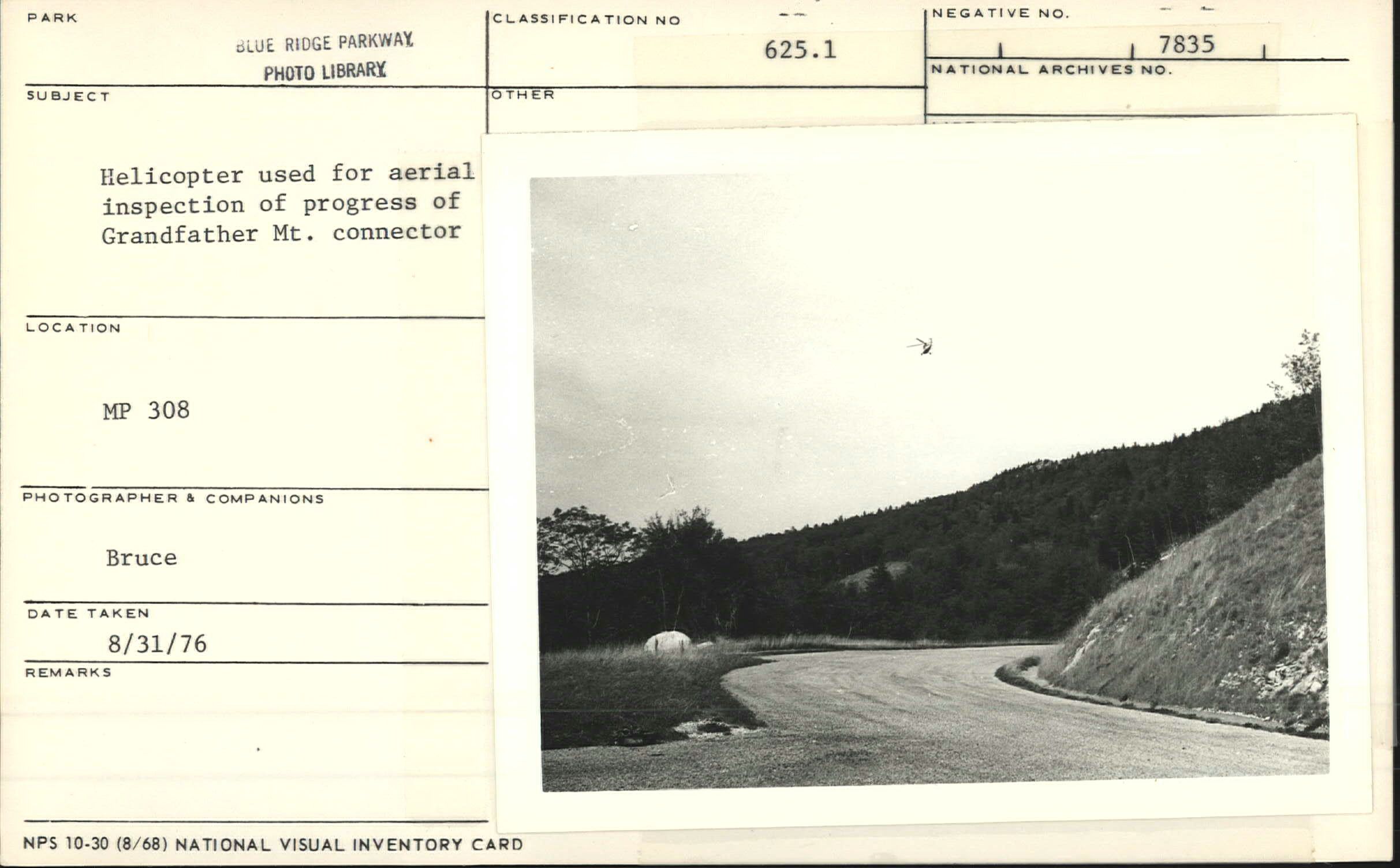 Helicopter flying for aerial inspection of Grandfather Mountain construction