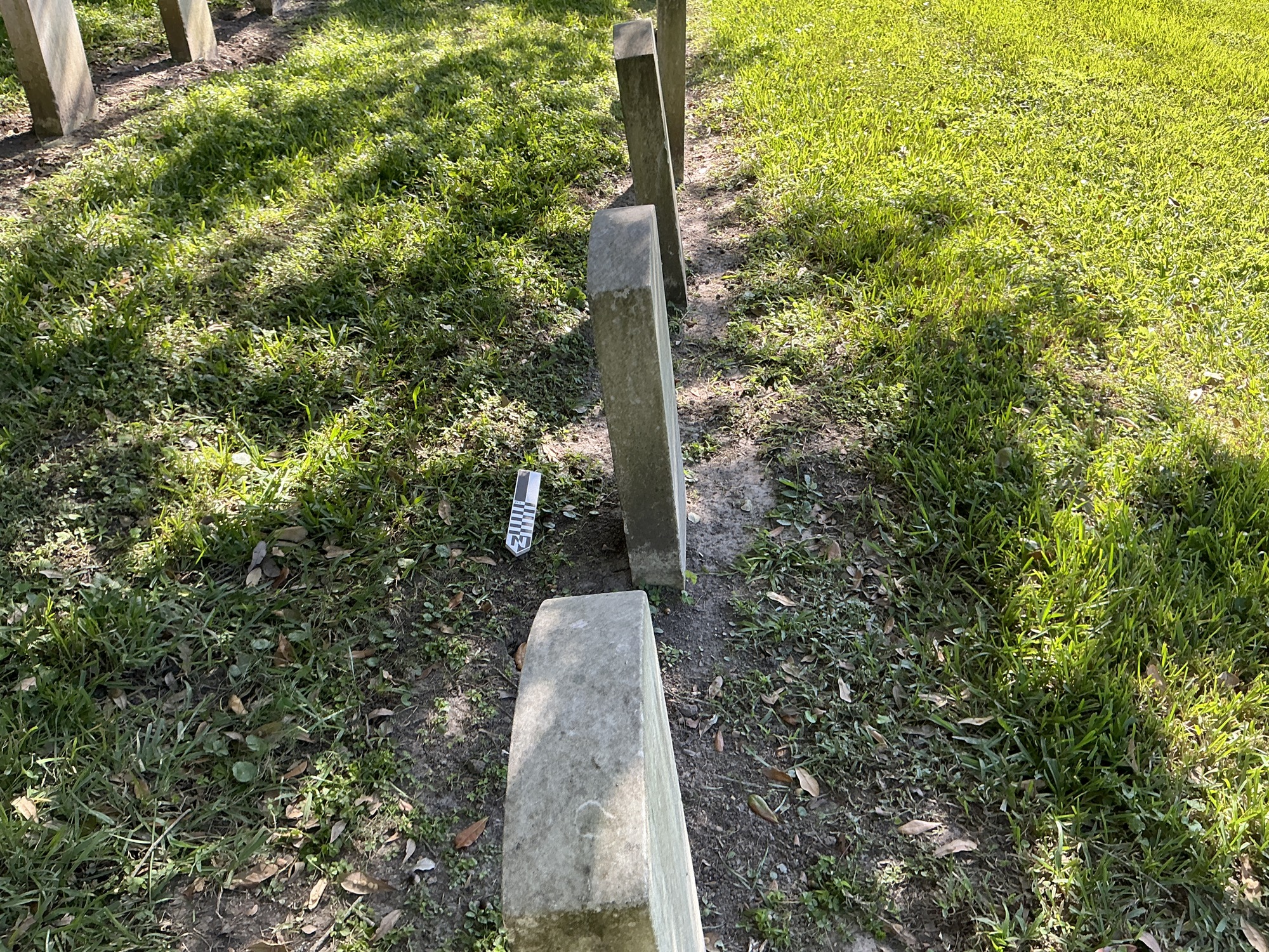 Extra image of historic upright marble headstone with recessed shield face.