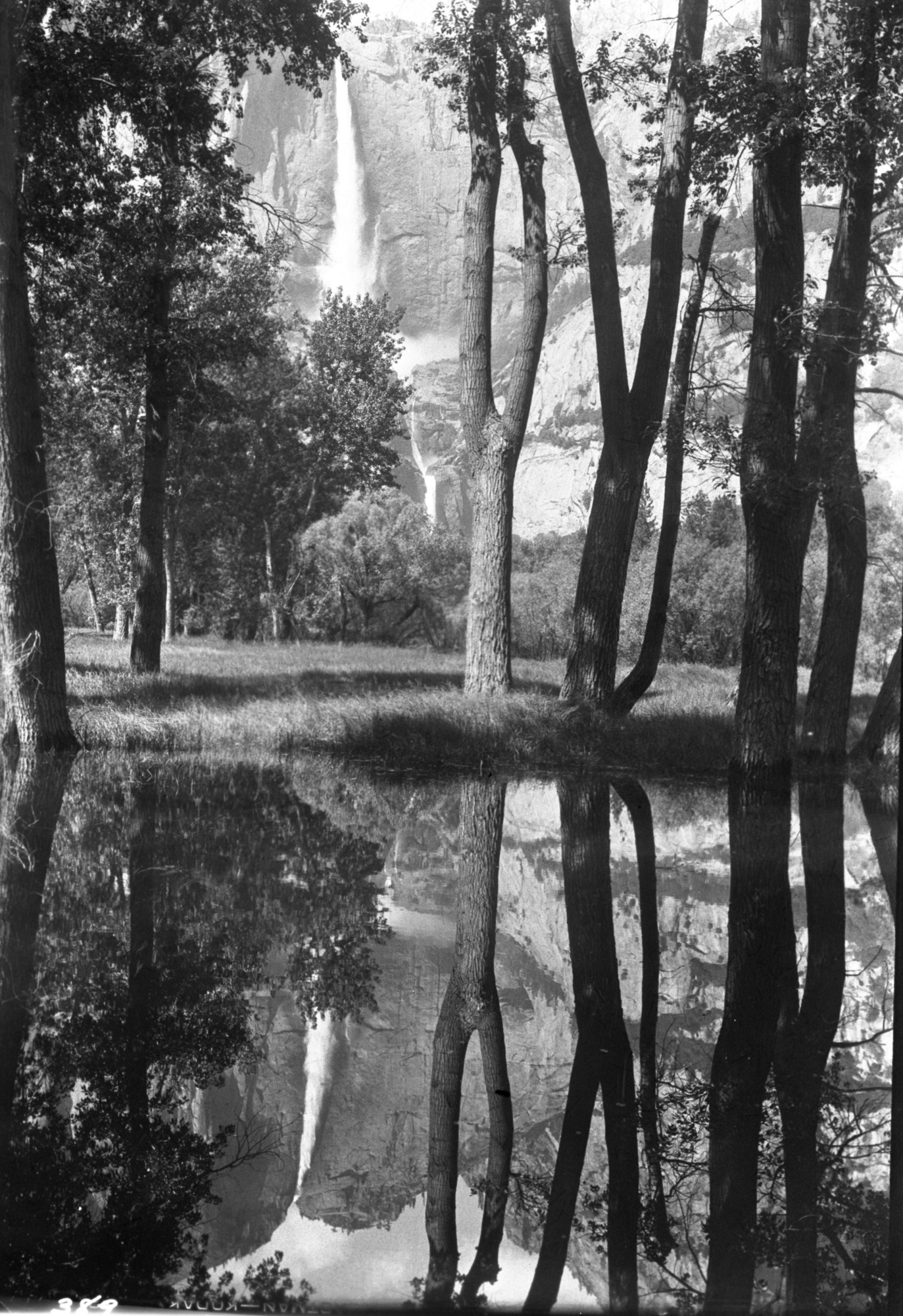 Copy Neg: L. Radanovich, May 1999. Yosemite Falls reflected in water.