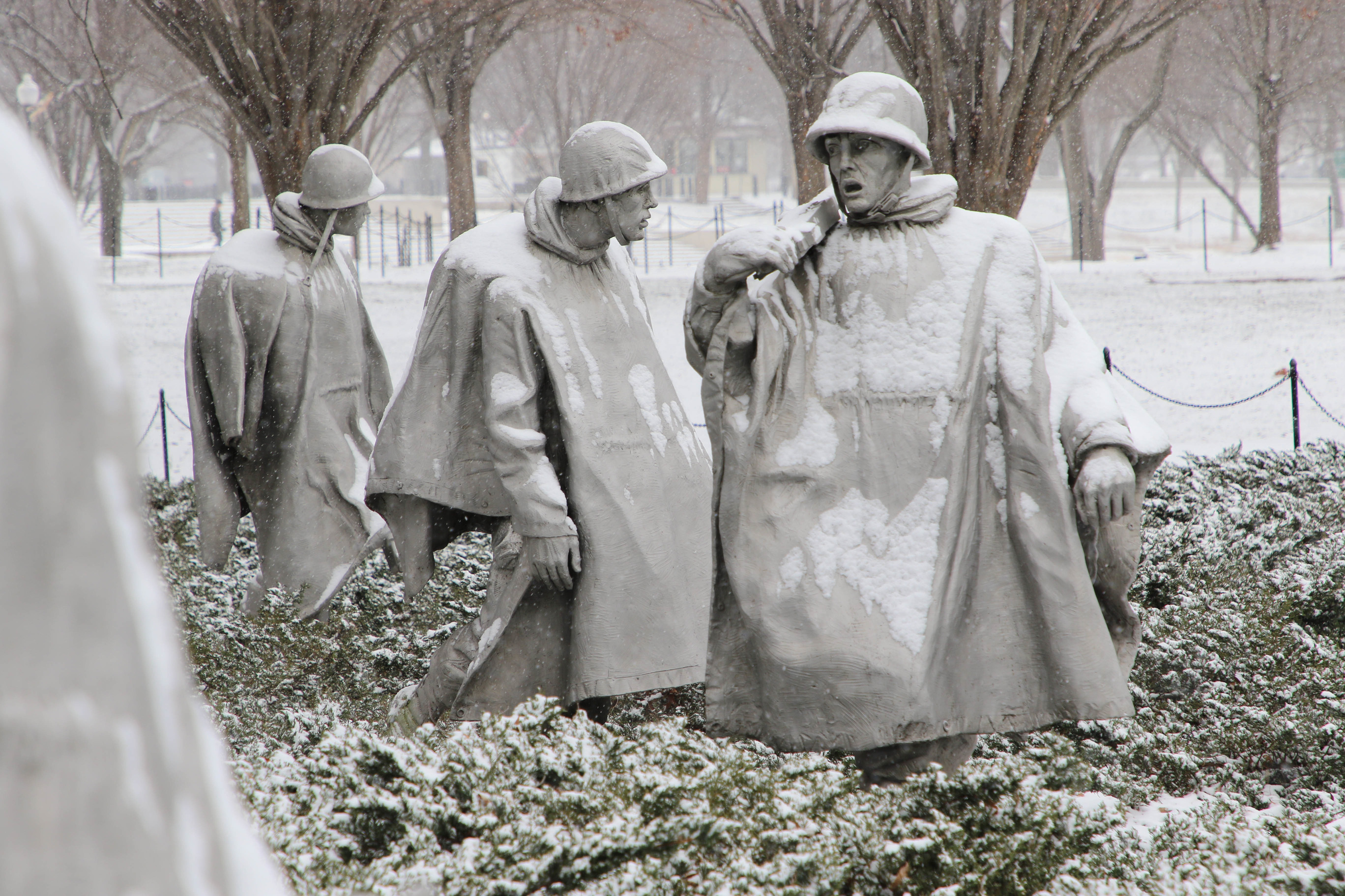 Snow-covered statues of American servicemen 