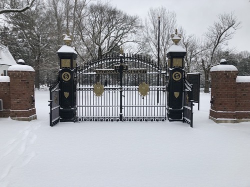 Iron gates covered in snow