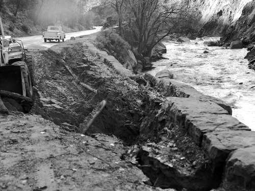 Flood damage - washed out road near Court of the Patriarchs in Zion Canyon .