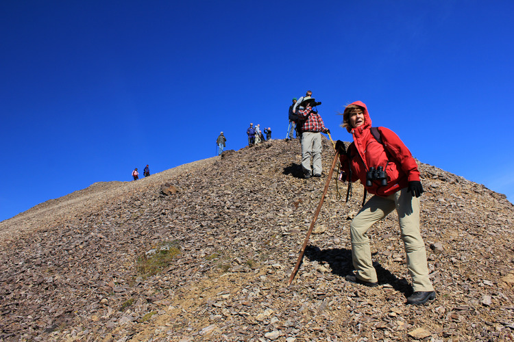 ten people hiking on a mountaintop