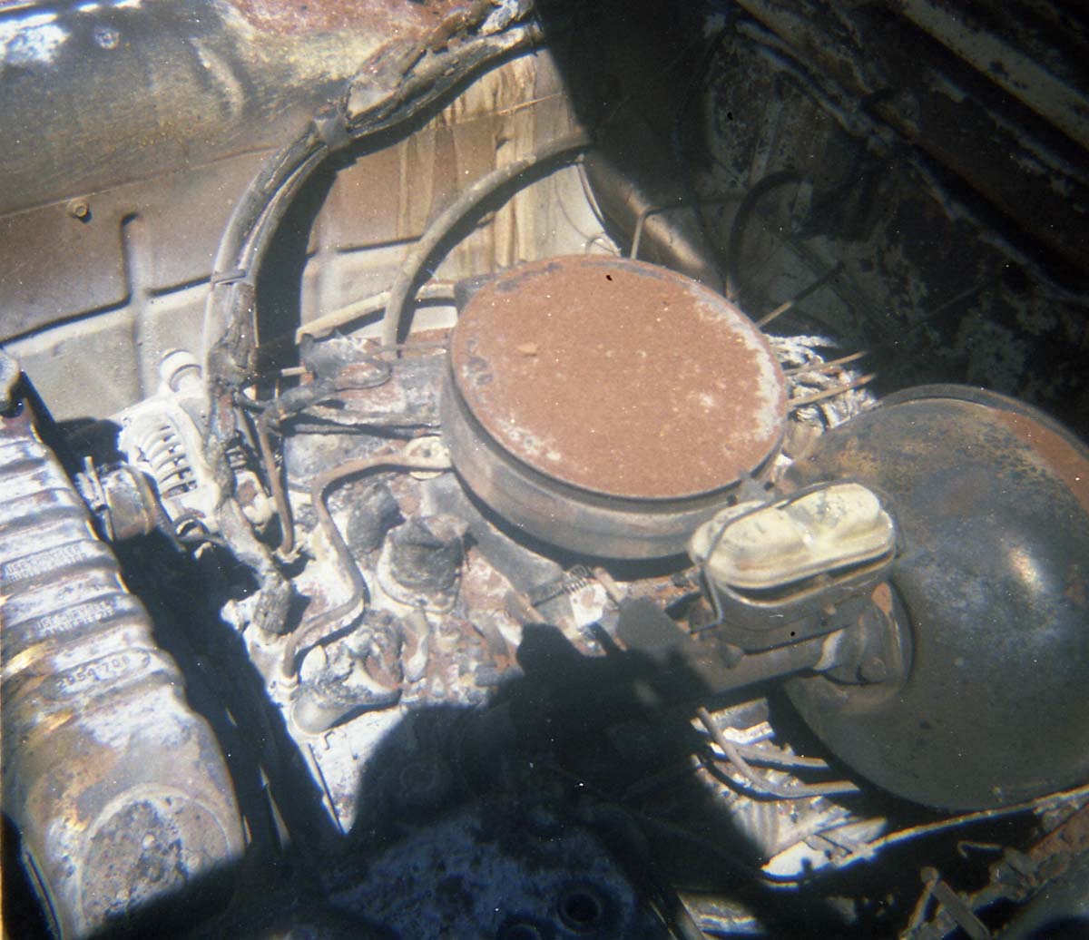 Color photo of an engine fire in a pickup.