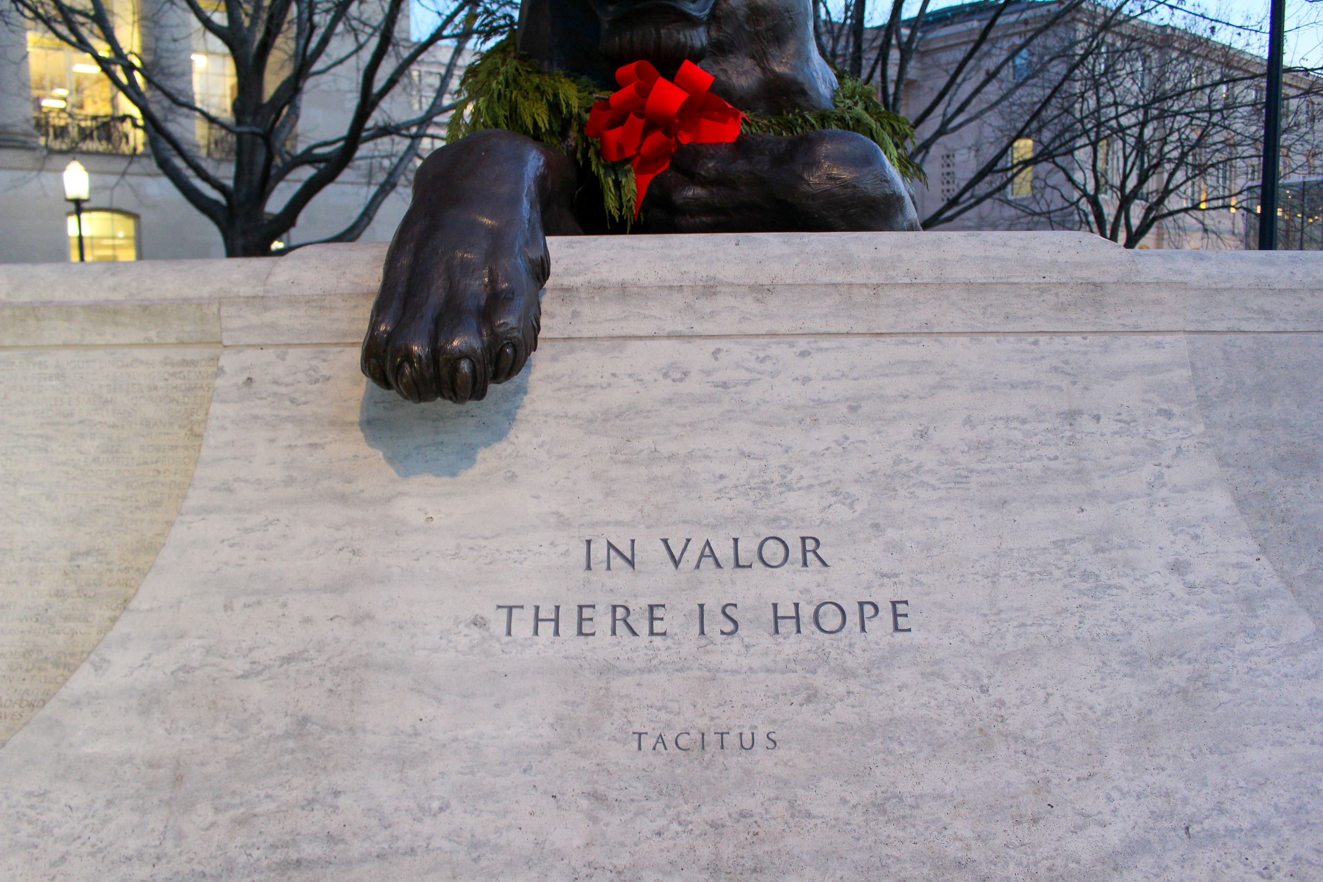 Marble wall inscription. Quote: "In valor there is hope." Tacitus