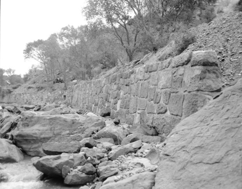 Flood damage to rock wall on Virgin River, a quarter mile south of Court of Patriarchs. Record of damage or defective workmanship.